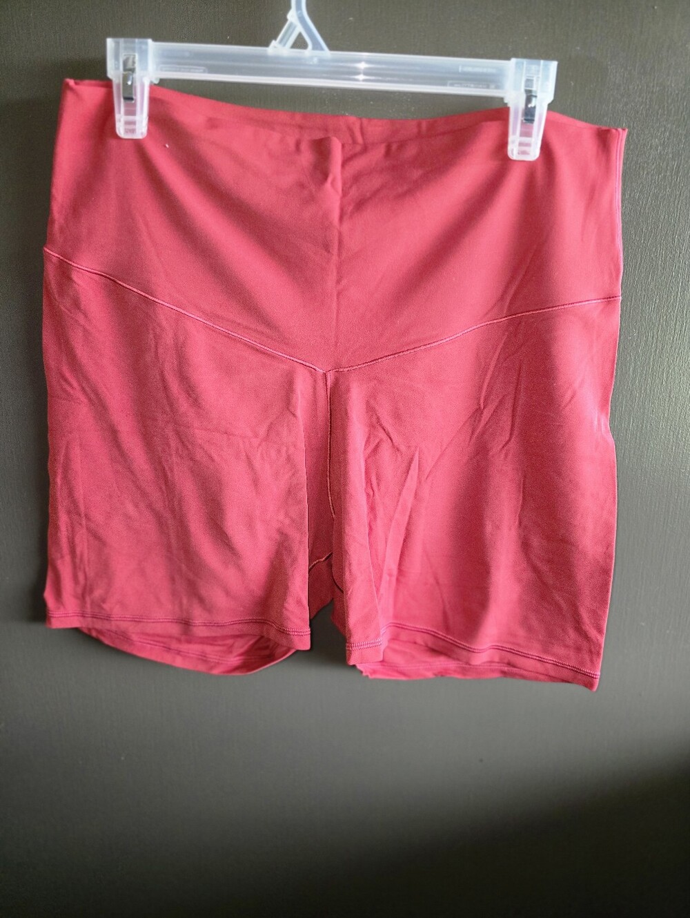 Women’s High-Rise Active Shorts in Rust Red.